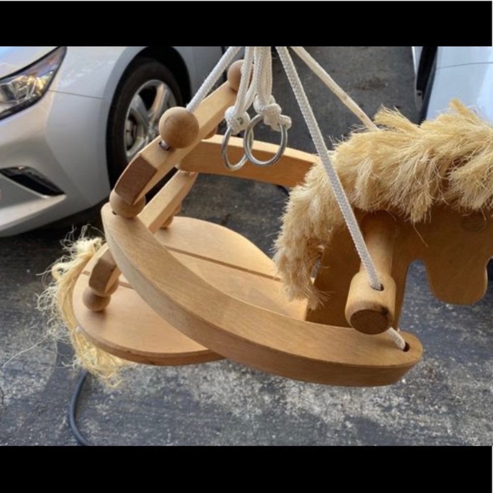 Wooden horse swing